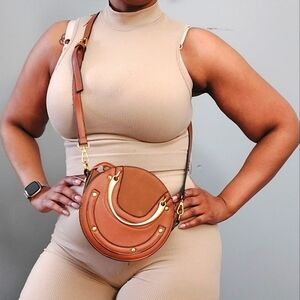 Brown and gold oval mini cross body boho bag